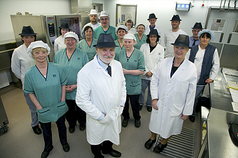 a group of medical professionals standing together facing the same direction